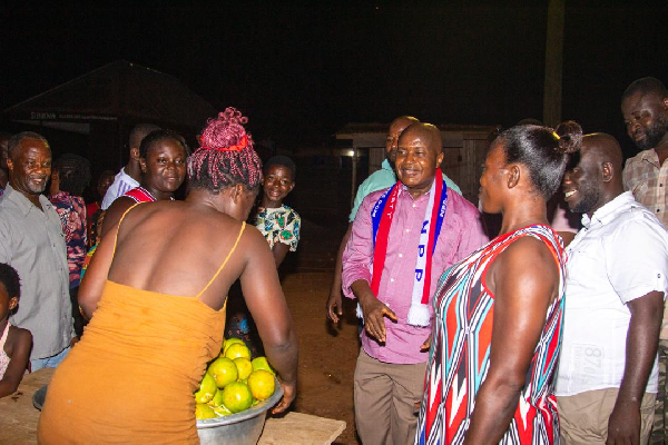 Stephen Ntim interacting with some people during a campaign