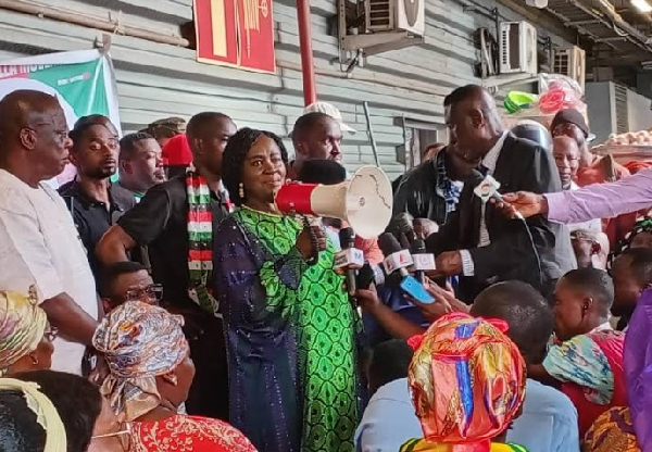 Prof. Jane Naana Opoku Agyemang interacting with the traders at Kejetia market