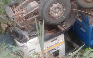 The driver of the tipper truck and his mate were trapped in the truck after it somersaulted