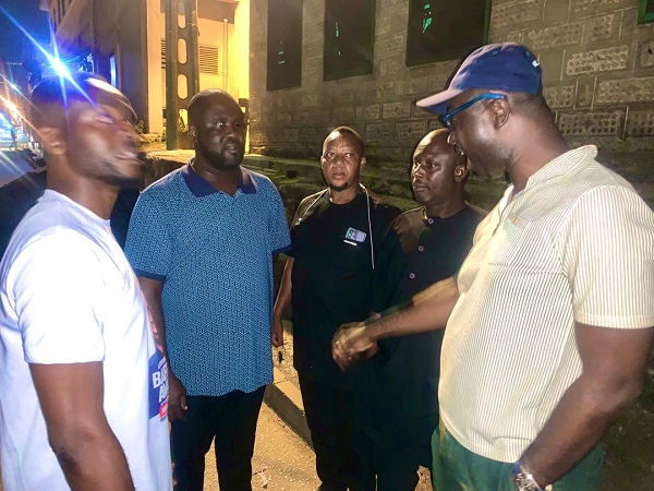 Baffour Awuah (blue cap) interacting with some supporters of the party