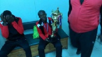 Francis Coffie poses with the league trophy
