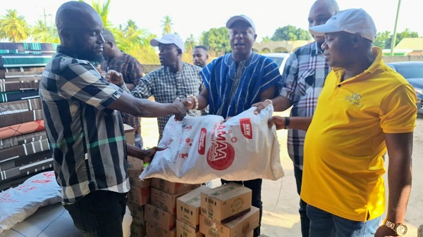 Wilmar Ghana Limited presenting the items to a representative of the Aflao Traditional Council