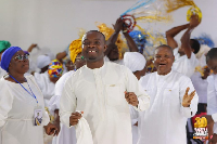 Evangelist Francis Awusi (Middle) with some church members