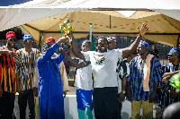 Captain of Fadama 133 receiving the trophy