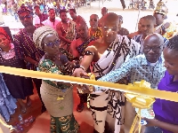 Dzifa Gomashie being helped to open the CHPS compound