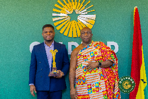Sammy Gyamfi with Odeneho Dr Affram Brempong III and the sword presented to him