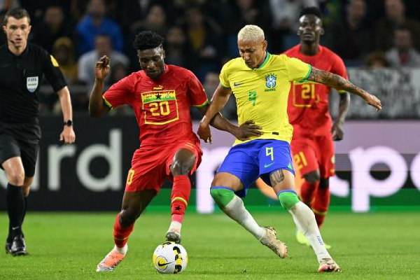 A photo of Mohammed Kudus and  Richarlison