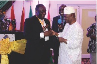 Mr. Godfred Djane (left) receiving the authority of office from Mr. L