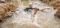 Democratic Alliance politician Helen Zille swims in a trench