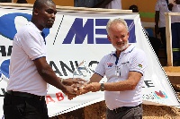 Mr. Daniel Asah of MBA presents a meritorious award to Mr. William Campbell, WHBO