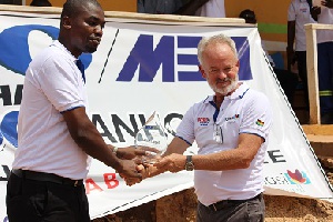 Mr. Daniel Asah of MBA presents a meritorious award to Mr. William Campbell, WHBO