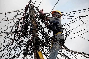 Man fixing electricity power lines