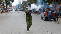 A police fires tear gas at a demonstration over police killings of people protesting