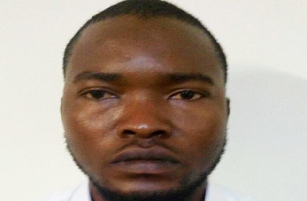Suspect Alex Kwami in police custody