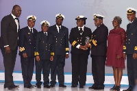 Captain Georgina Joppa being supported to collect her award