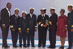 Captain Georgina Joppa being supported to collect her award