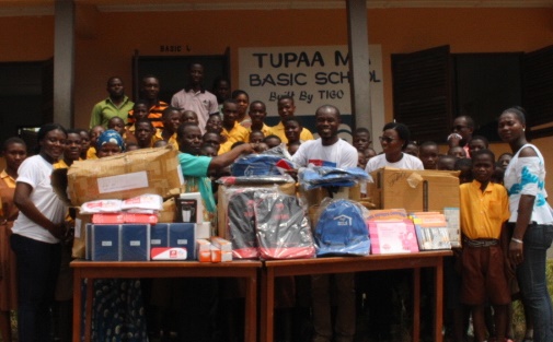 Staff of AirtelTigo read to the pupils and donated supplies to both schools in separate events