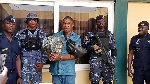 The suspect Aremu Timothy Adegboyega with custom officers