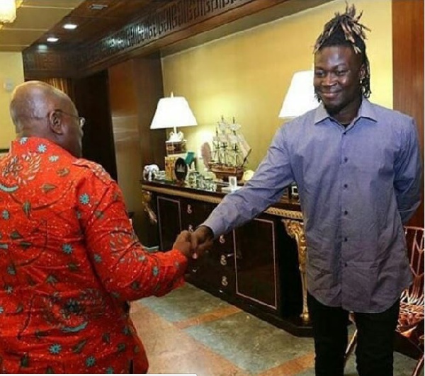 Wisa Gried in a handshake with President Akufo-Addo at the Jubilee house