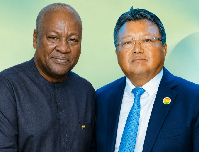 President John Mahama and Chairman of CAITECH, Tang Hong (R)