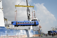 Coaches being unloaded unto the Ship Unisun for shipment to DR Congo