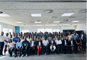 Staff of Standard Chartered in a photograph with the adolescent boys
