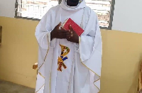 A file photo of a Catholic Priest holding a bible during mass