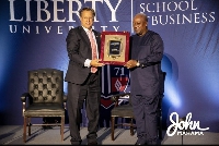 Ex-President Mahama receiving the award from Dr. Dave Brat