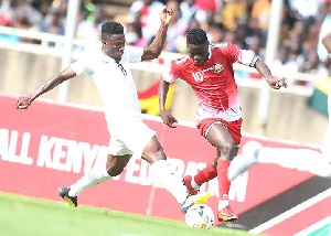 Ghana's Afriyie Acquah in a challenge for the ball in the game against Kenya
