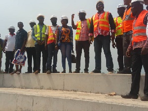 Sports Minister Isaac with staff of the construction company at the site