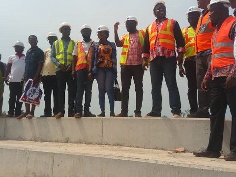 Sports Minister Isaac with staff of the construction company at the site