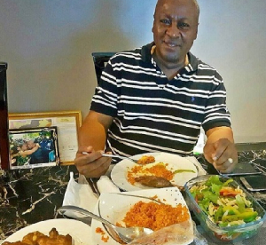 President John Dramani Mahama eating jollof