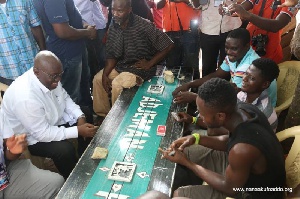 Akufo-Addo (in white on the left side of the bench)
