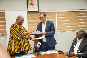 CEO of EXIM Bank Sylvester Adinam Mensah (L) with the Ghana International Bank, Ian Greenstreet