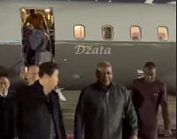A screenshot of President Mahama's arrival in South Korea with the 'Dzata' in the background