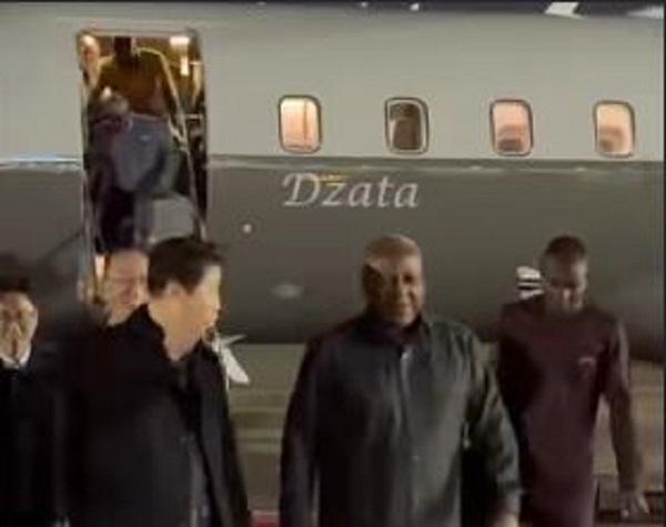 A screenshot of President Mahama's arrival in South Korea with the 'Dzata' in the background