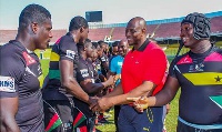 Ghana Rugby Chief, Herbert Mensah inspecting both teams