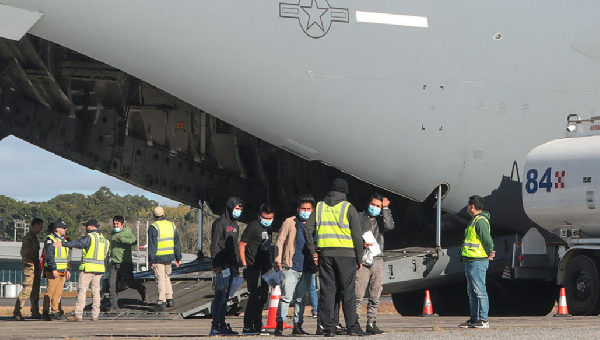 Migrants seen at the airport