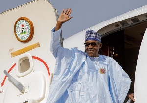 File photo of Buhari boarding a plane