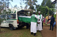 Family members receive the body of Hayaan Kakooza on Saturday