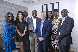 Chief Executive of tigo Roshi Motman, [2nd from left] with some tigo officials in a photograph