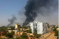 Smoke billows above residential buildings in Khartoum, during fighting in April 2023