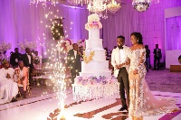 Sarkodie and his wife cutting the cake