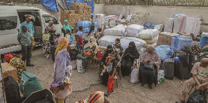 Sudanese refugees wait for buses at a station in Egypt's capital Cairo on May 13, 2025