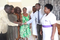 Amanda Jissih with others presenting the money to doctors at Korle-Bu Teaching Hospital