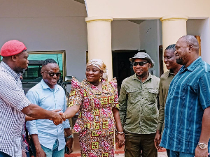 Selorm Mahama Dzramado (R) shaking hands with Victoria Amefadzi Yawa Doe (M) and other members