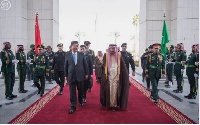 Saudi King Salman (centre R) and Chinese President Xi Jinping review the honour guard.