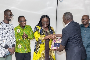 Alhassan Mahama Sani, presenting a citation to Prof. Rita Akosua Dickson