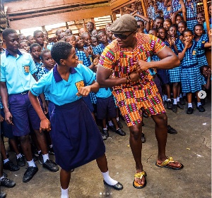 Michael Dapaah with Ghanaian school children