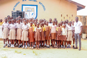 Debrah Bekoe Isaac in a pose with students of Attabui MA